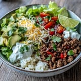 This Low Carb Burrito Bowl with savory beef, fluffy cauliflower rice, and fresh toppings is ready in about 35 minutes.