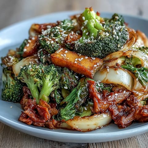 Steam rises from the hot pan as colorful winter vegetables and probiotic-rich kimchi are sautéed for a healthy, savory main dish.  
