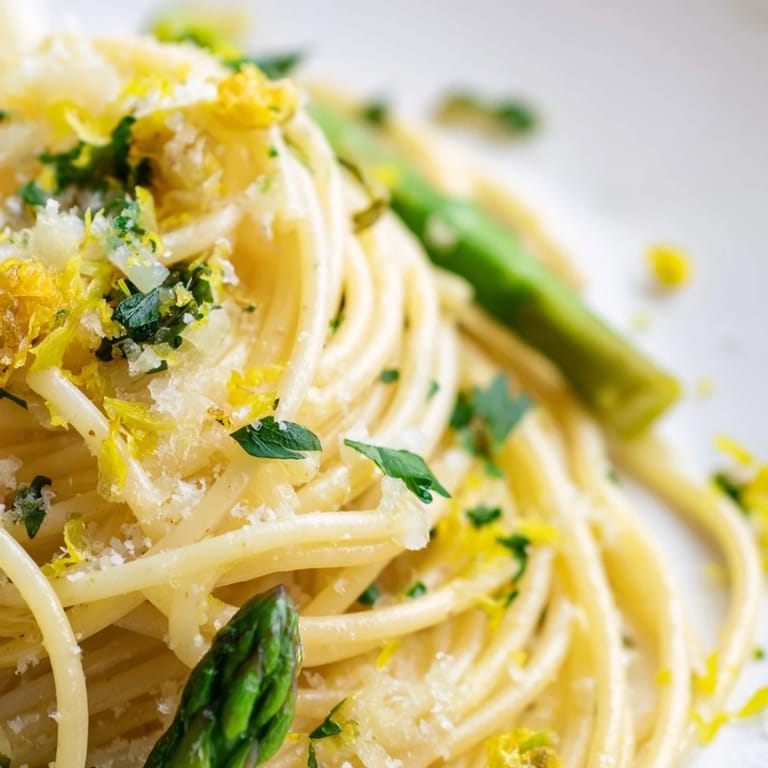 Serve this Roasted Garlic & Asparagus Pasta warm, garnished with chopped parsley and a sprinkle of extra cheese.