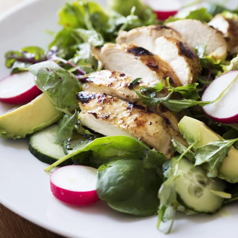A vibrant Spring Detox Chicken Salad featuring grilled chicken, crisp vegetables, and a bright lemon dressing, ready to serve for a healthy meal.