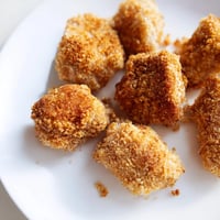 Golden, crispy popcorn chicken piled high, ready to be dipped and enjoyed as a delicious snack.